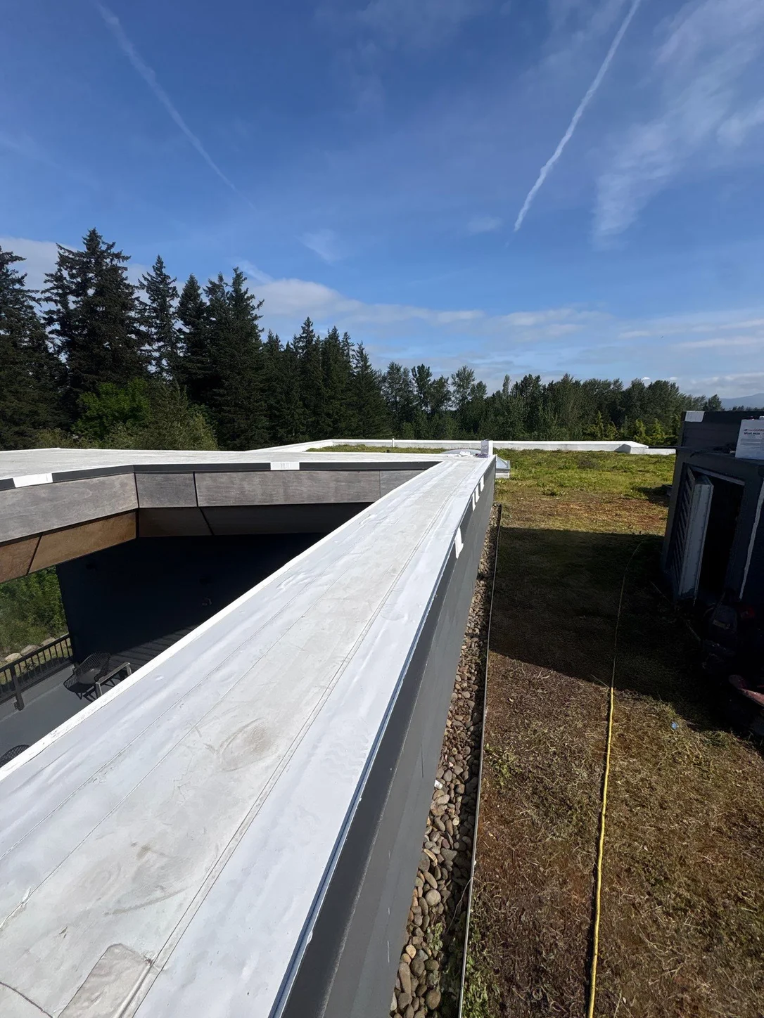 A clean, capped metal edge running the full length of the roof's perimeter.